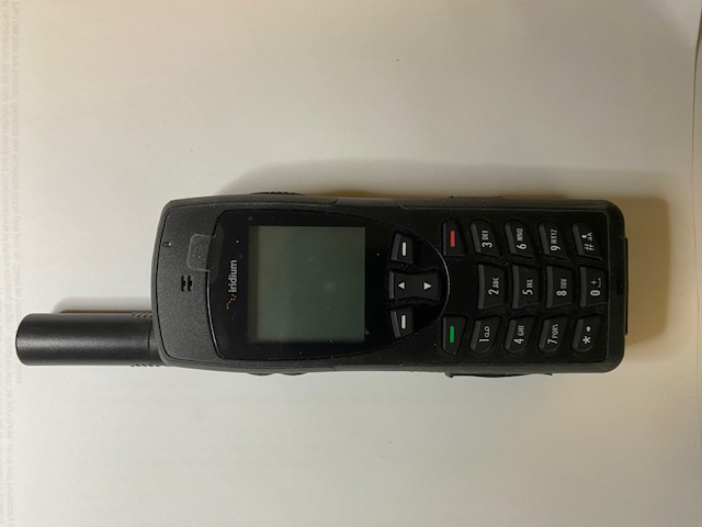 Photo of Iridium 9555 satellite phone with extras including Pelican carry case