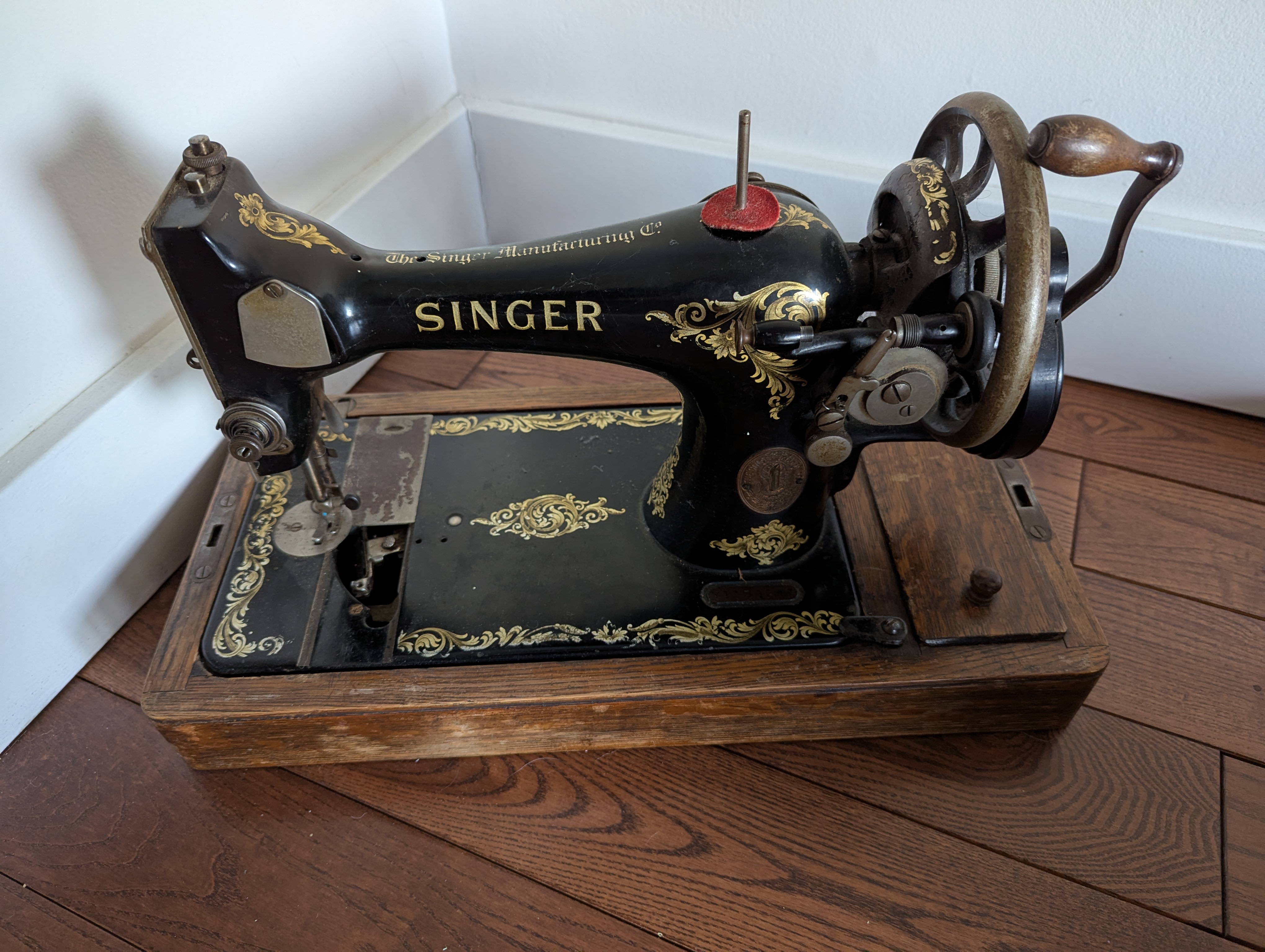 Photo of Antique portable singer hand crank sewing machine 