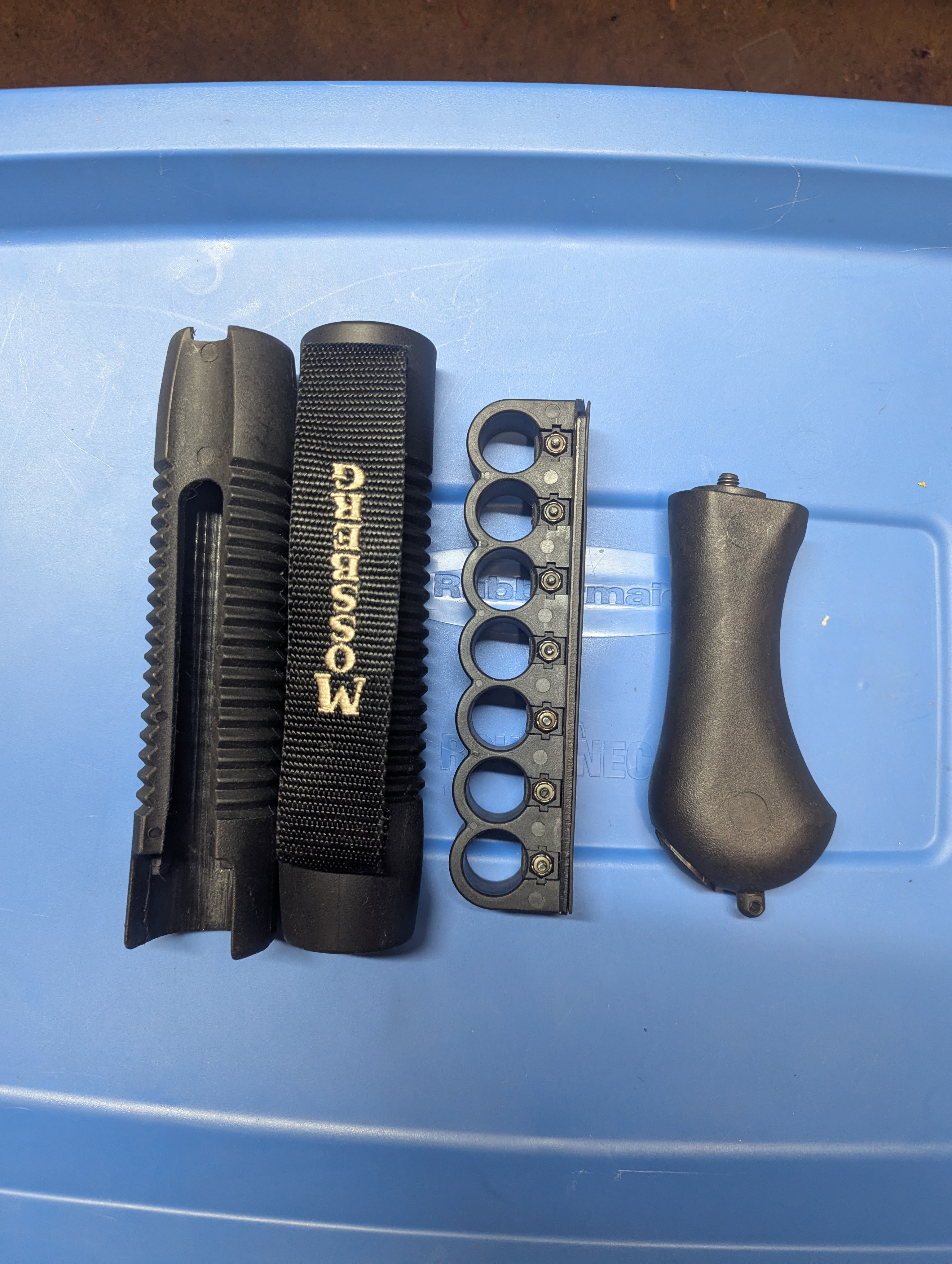 Photo of Mossberg raptor grip, archangel sidesaddle shell carrier , 2 forends  