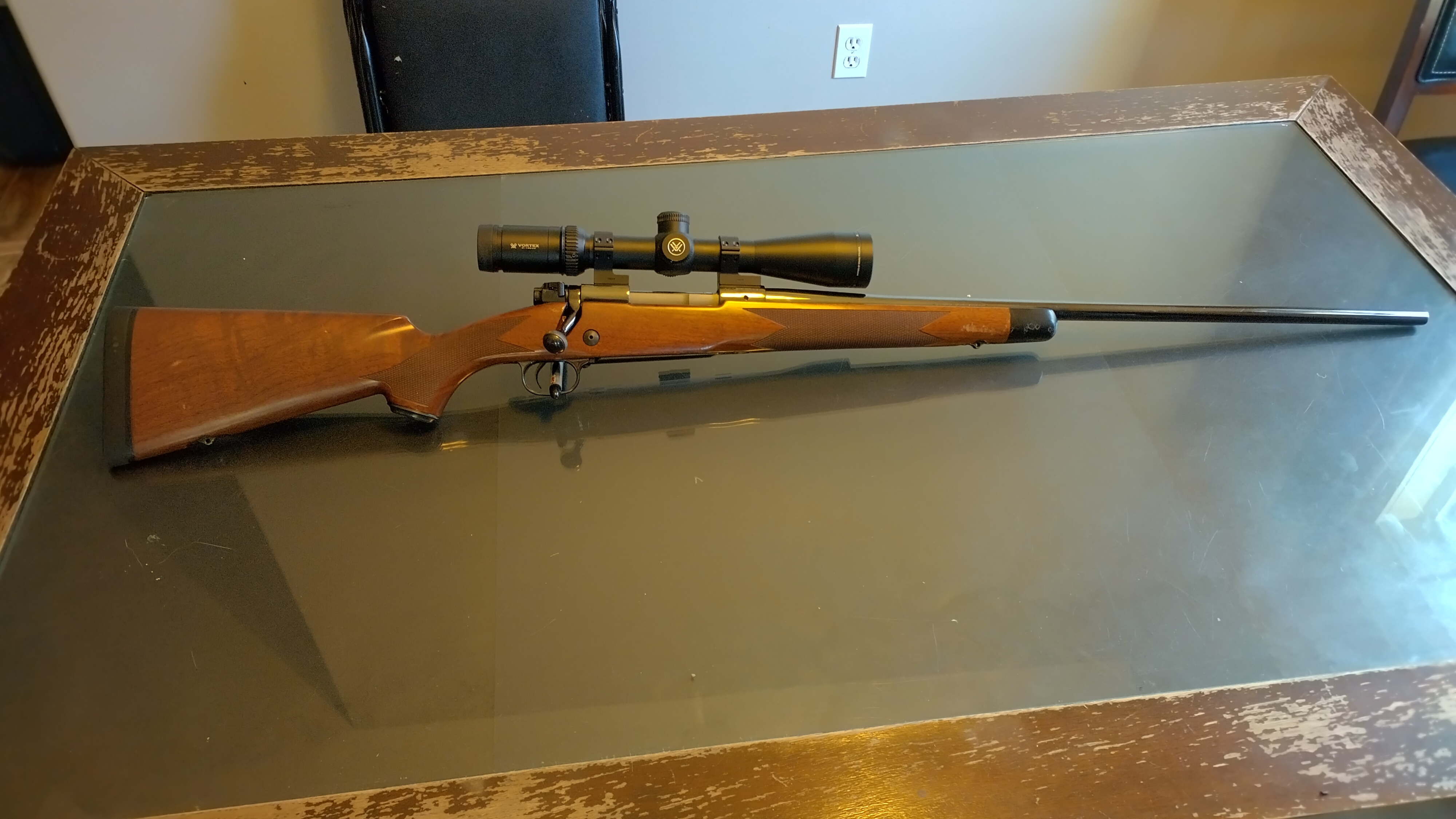 Photo of 7 mm Winchester Model 70 super grade French walnut w/ scope