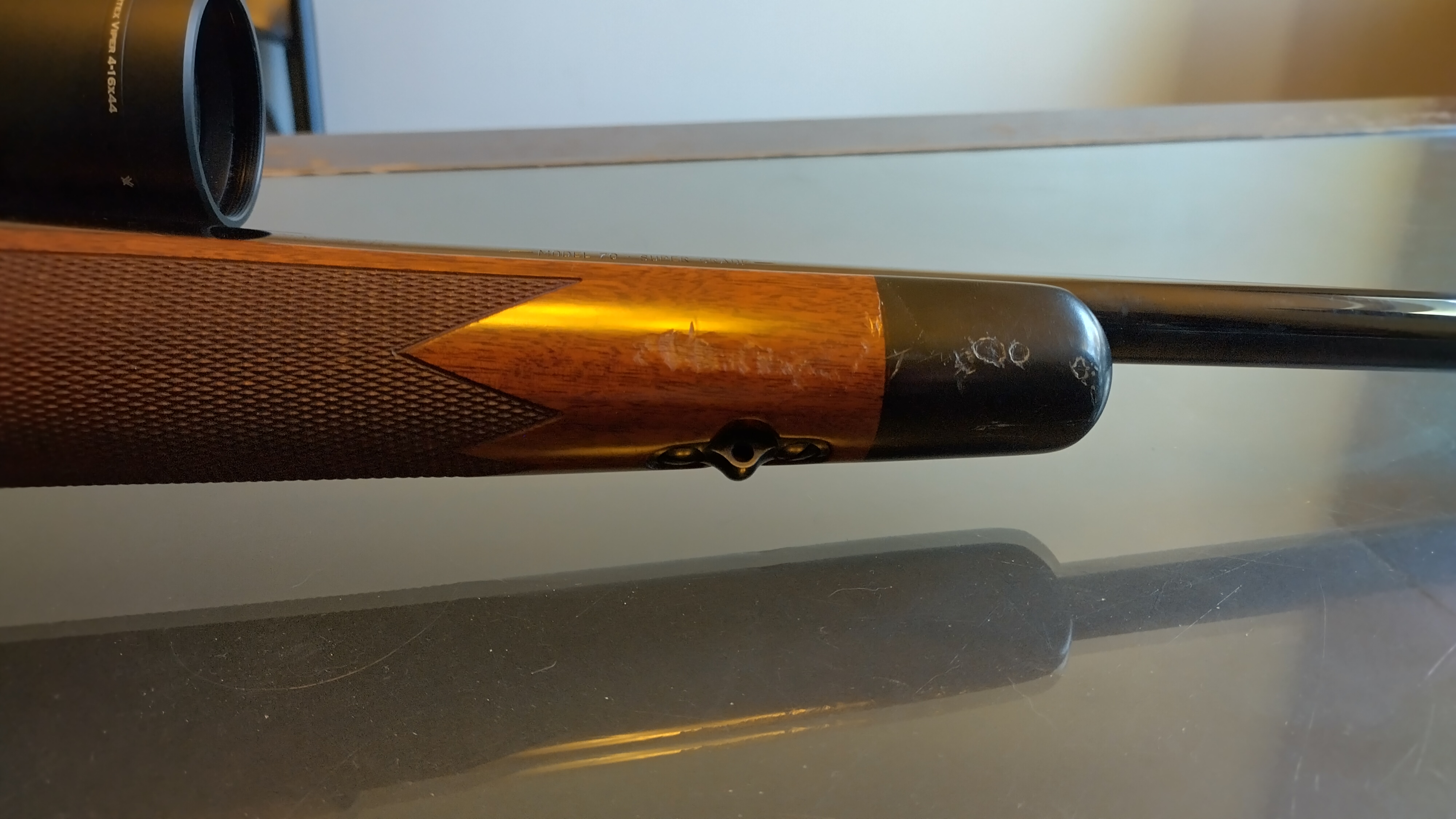 Photo of 7 mm Winchester Model 70 super grade French walnut w/ scope