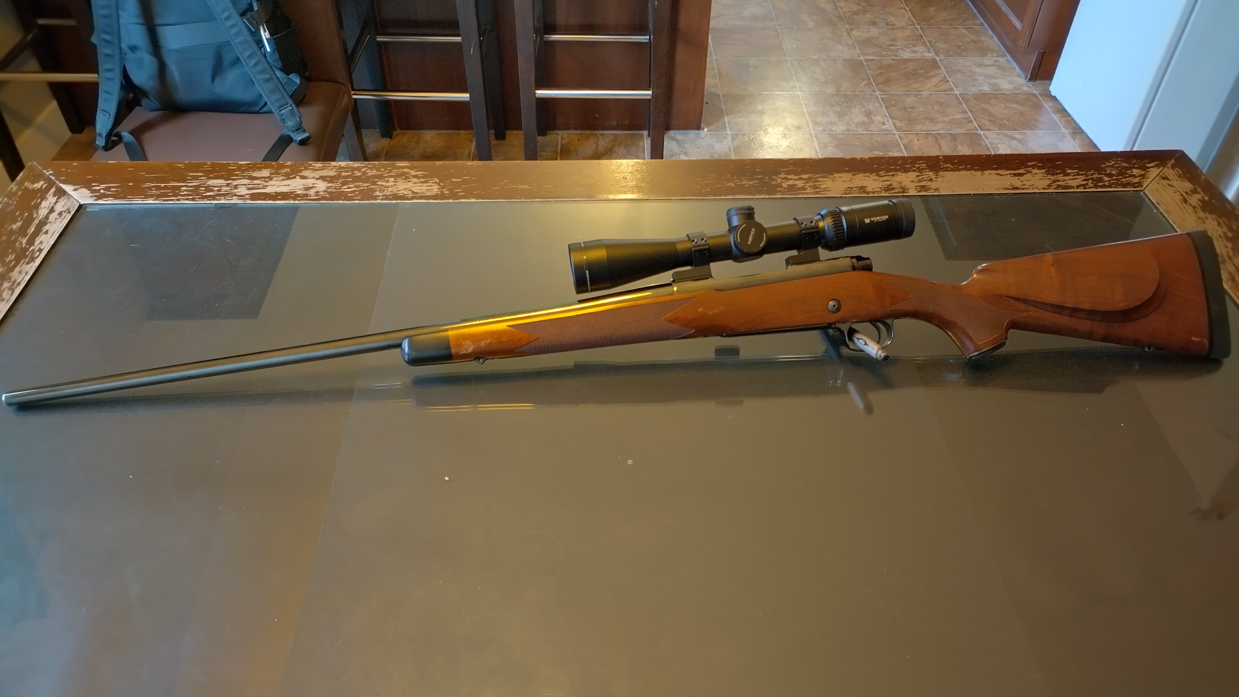 Photo of 7 mm Winchester Model 70 super grade French walnut w/ scope