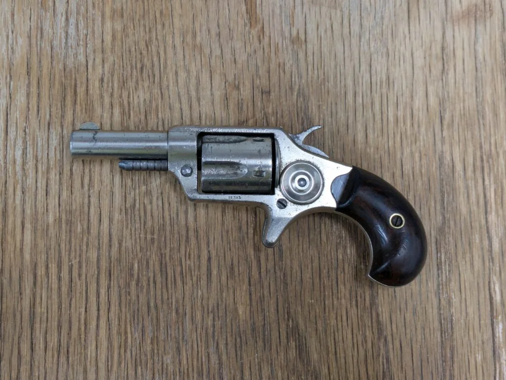 Photo of Antique Status Colt new 32 etched barrel