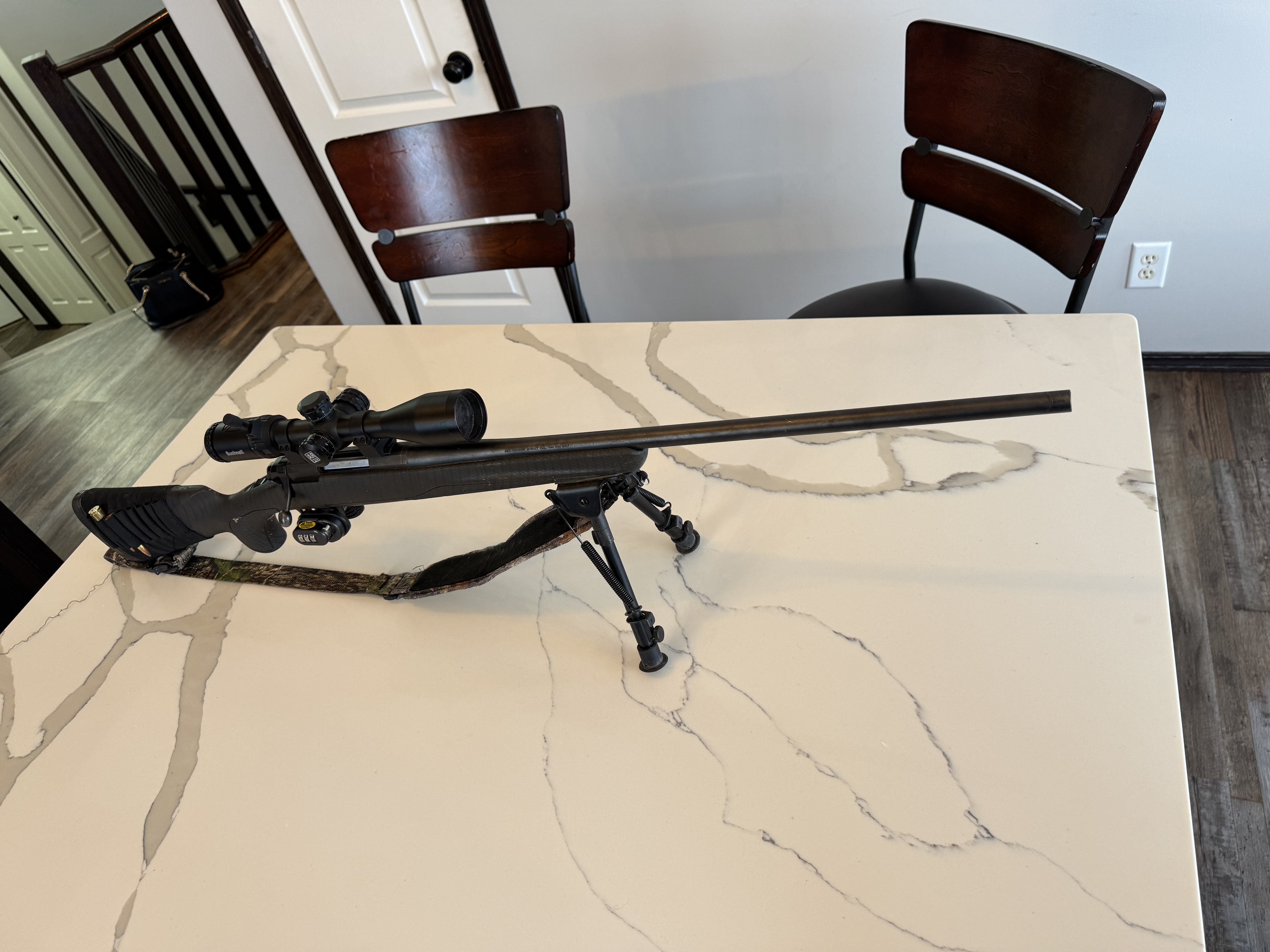 Photo of 7mm short mag Browning X bolt riffle and Bushnell scope 