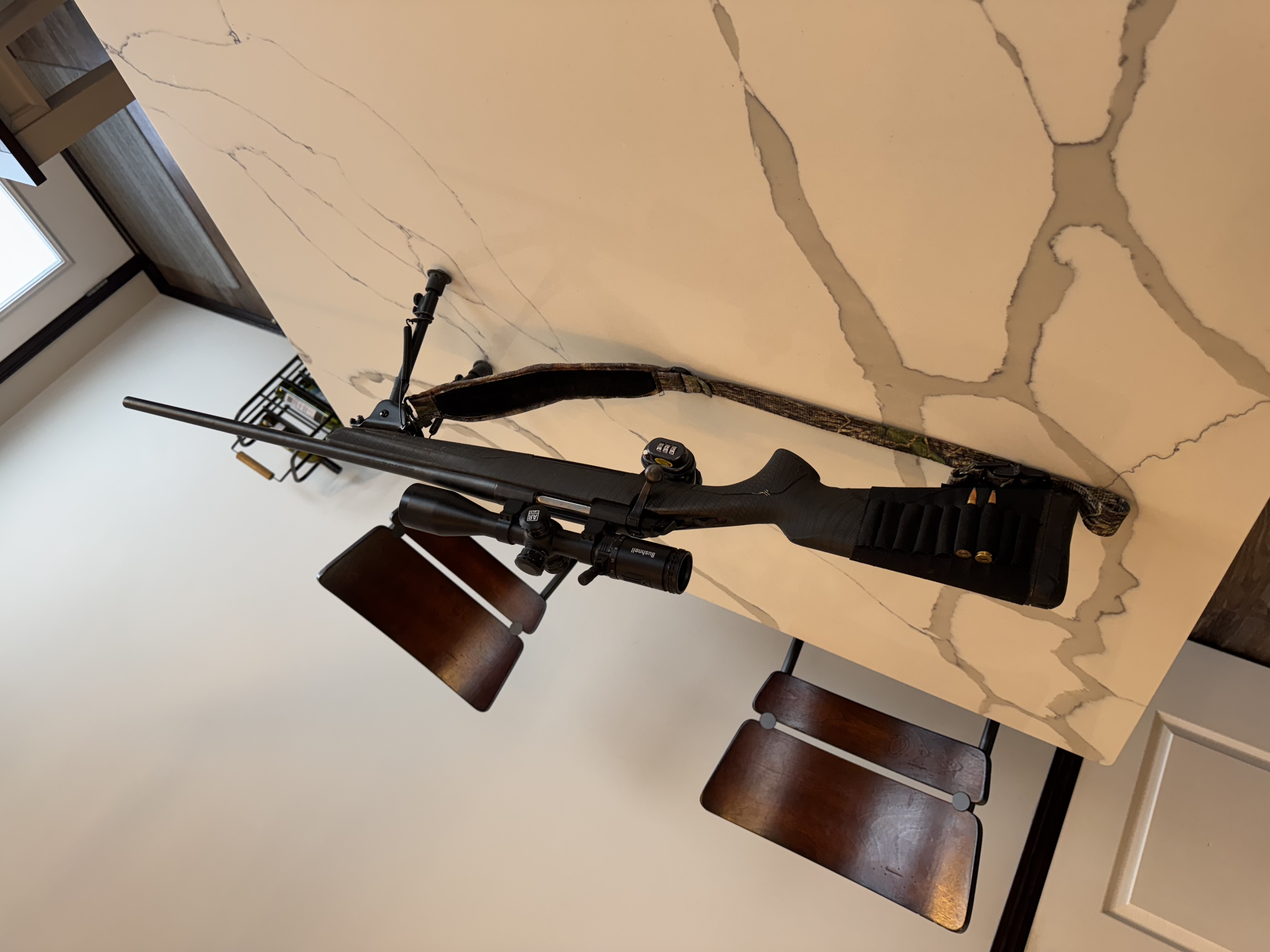 Photo of 7mm short mag Browning X bolt riffle and Bushnell scope 