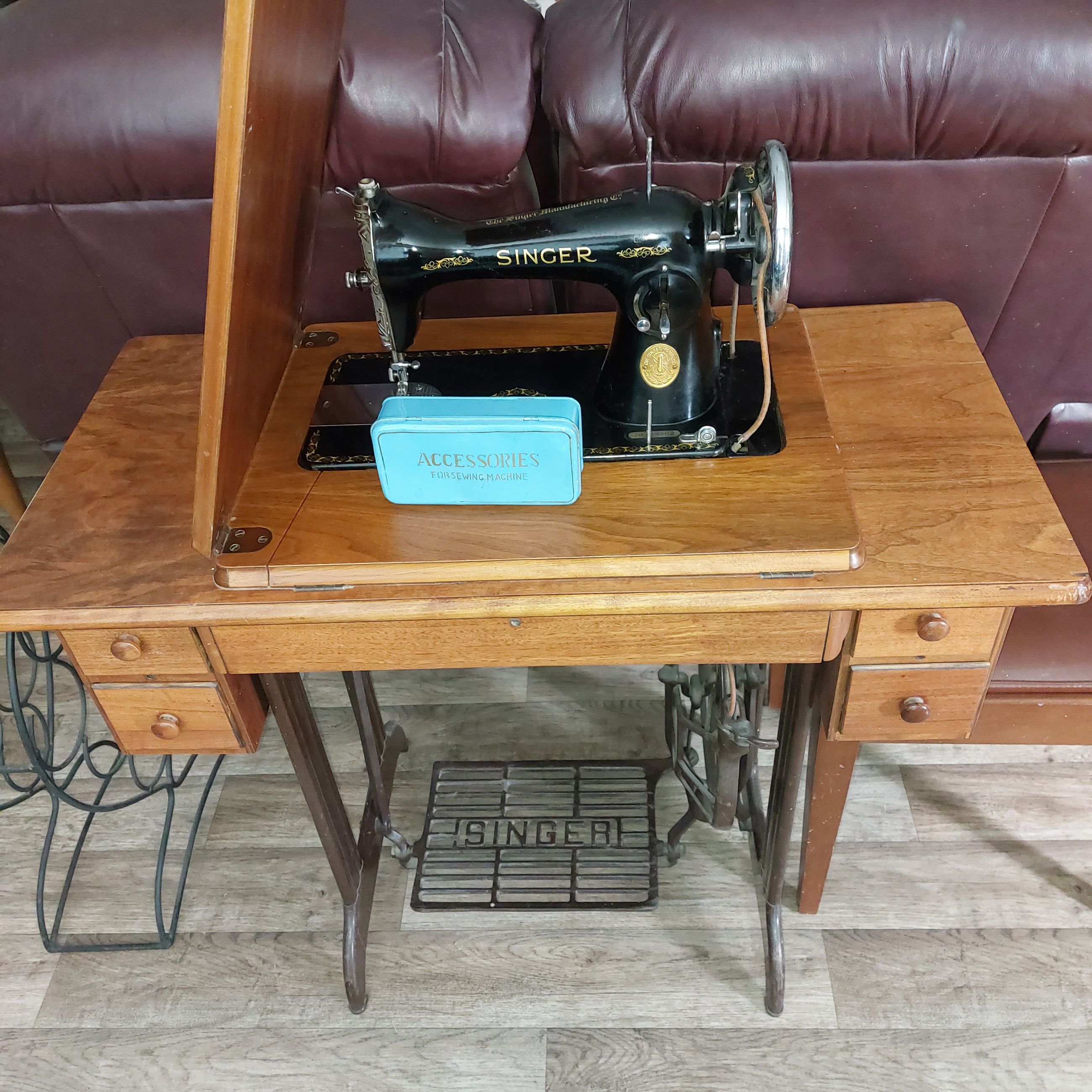Photo of Vintage Treadle Singer Sewing machine and Stool