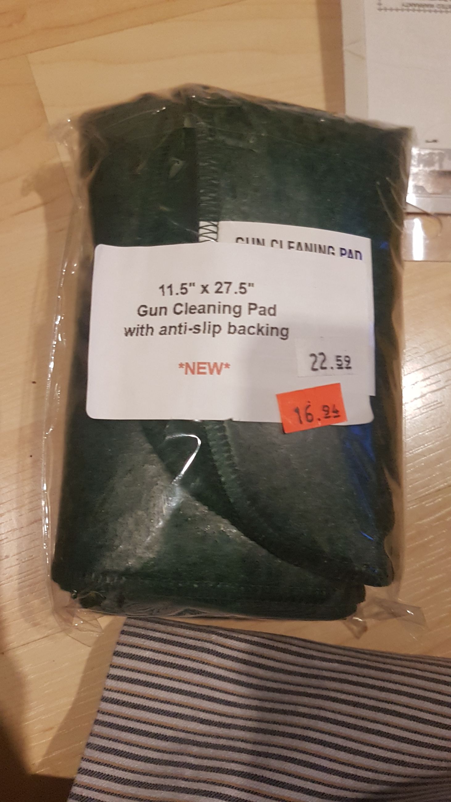 Photo of 11.5" x 27.5" green gun cleaning pad with anti-slip backing (mellonRSCA)