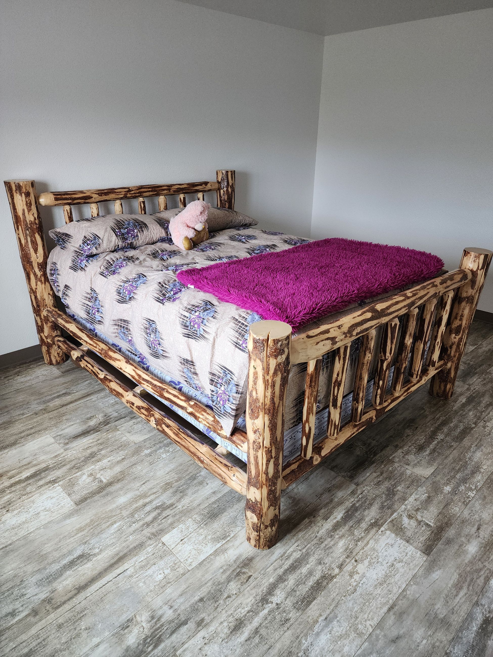 Photo of Queen size log bed frame 