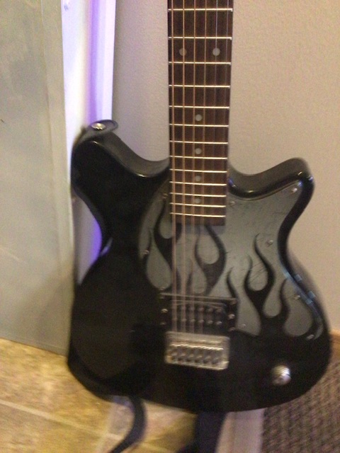 Photo of Electric n acoustic guitars