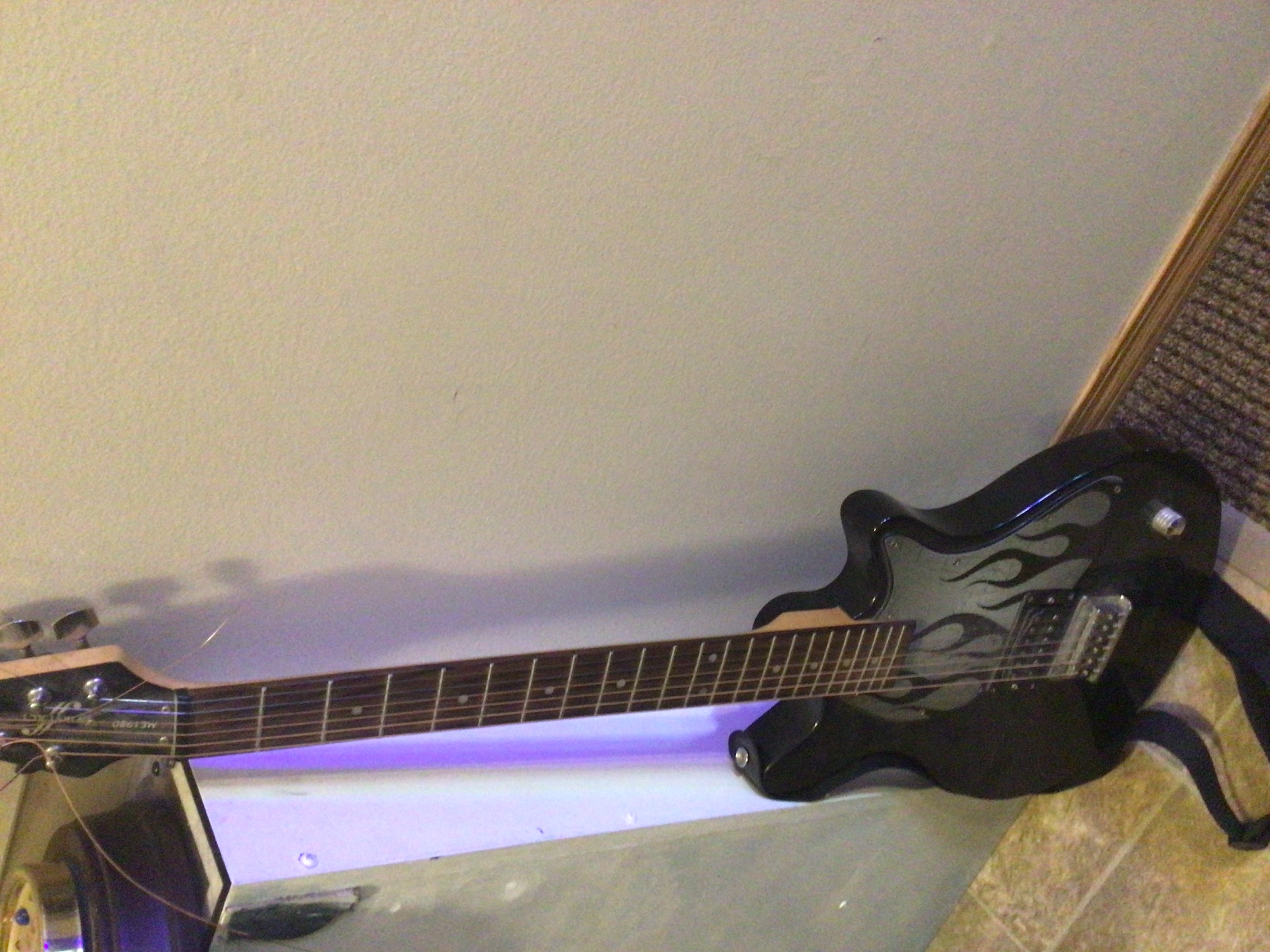 Photo of Electric n acoustic guitars