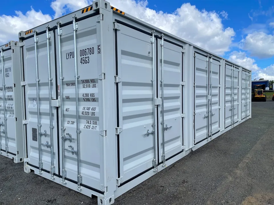 Photo of 40-foot High Cube shipping container with 4 open side doors and a height of 9.5 feet