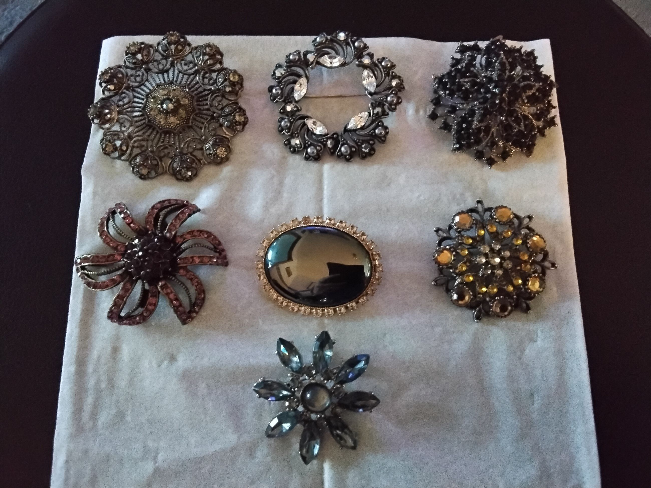 Photo of Brooches, $20 each, view photos