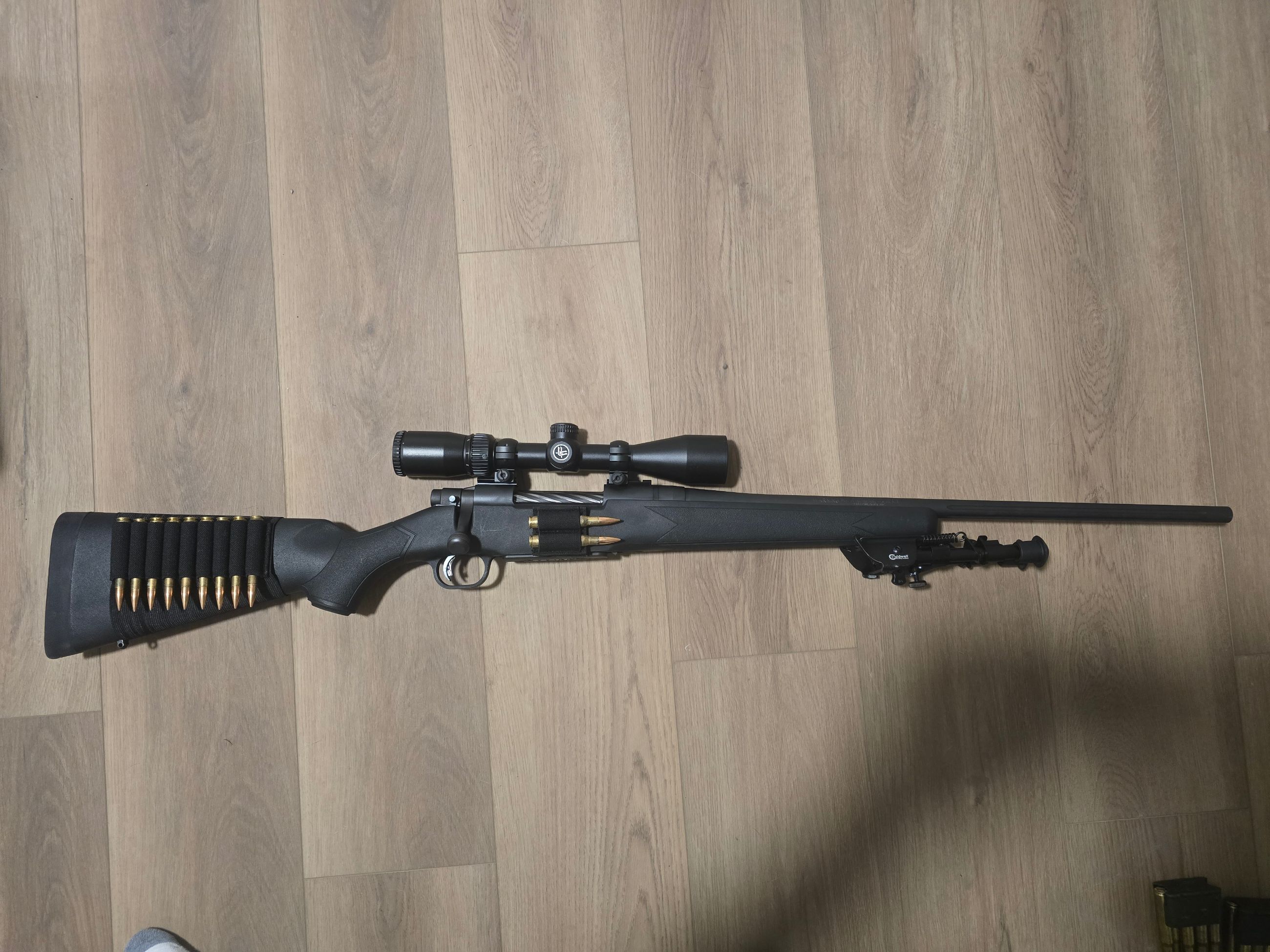 Photo of Mossberg 3006 with extras