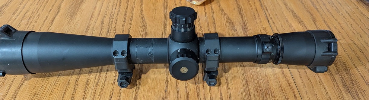 Photo of LEUPOLD MARK 4 4-10X40 LT/R C/W MARK 4 RINGS; LEUPOLD FLIP UPS LENSE COVER, TARGET TURRETS
