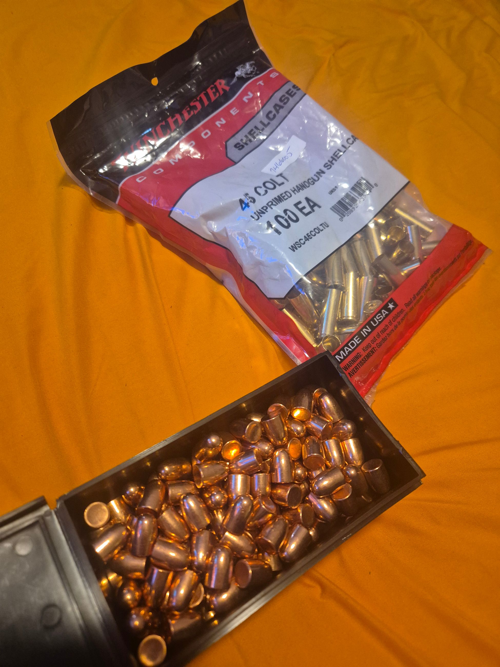 Photo of 45 long colt brass + bullets