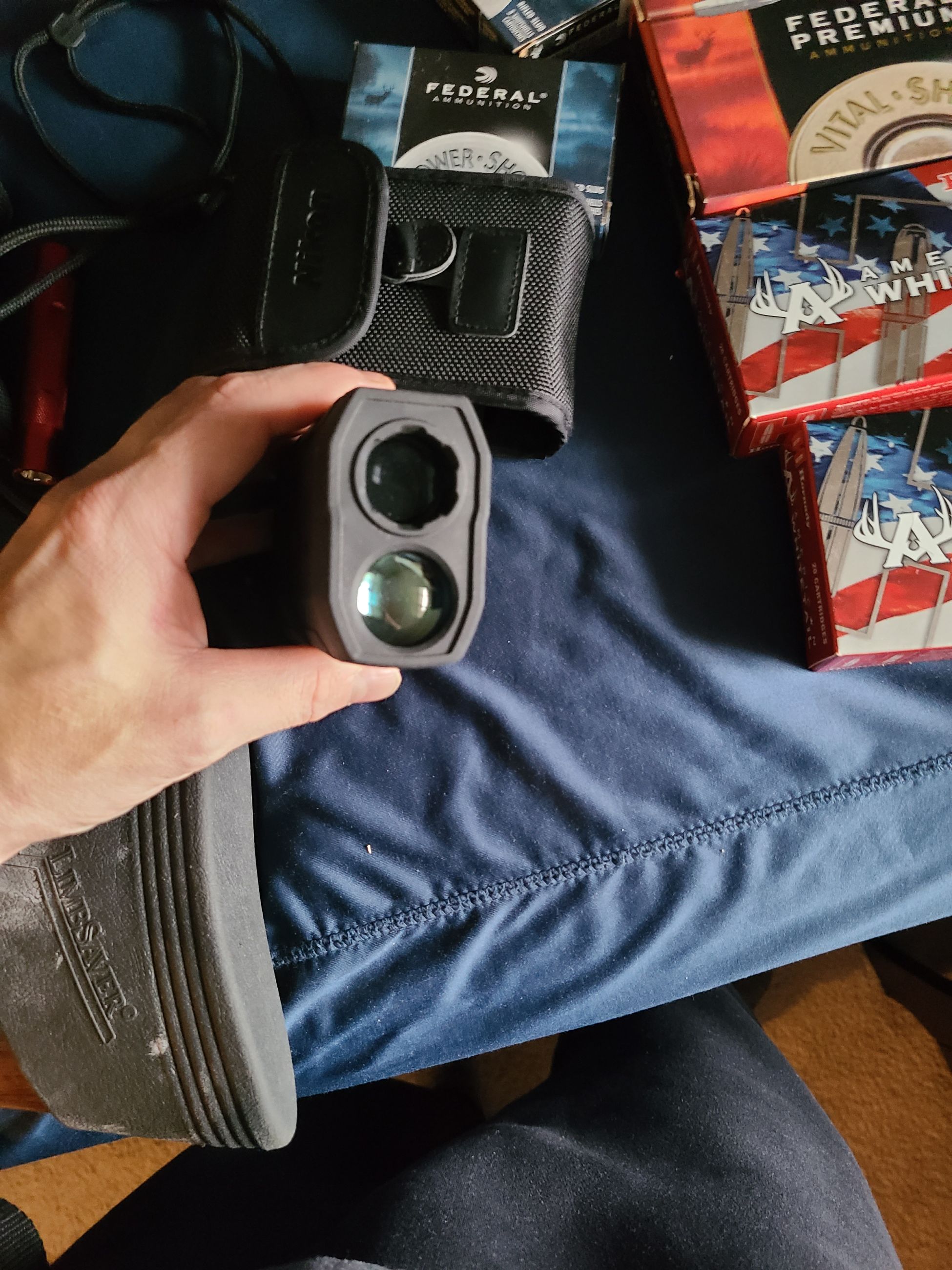 Photo of 4 guns, ammo, rangefinder, safe.