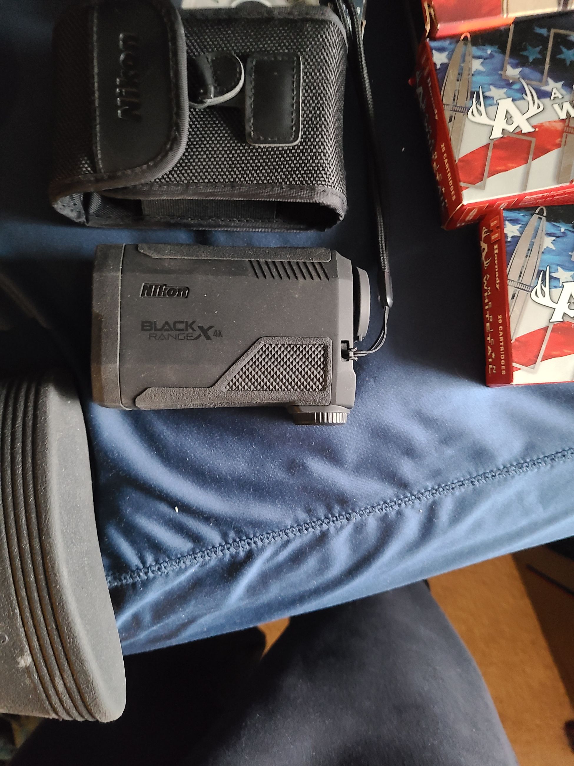 Photo of 4 guns, ammo, rangefinder, safe.