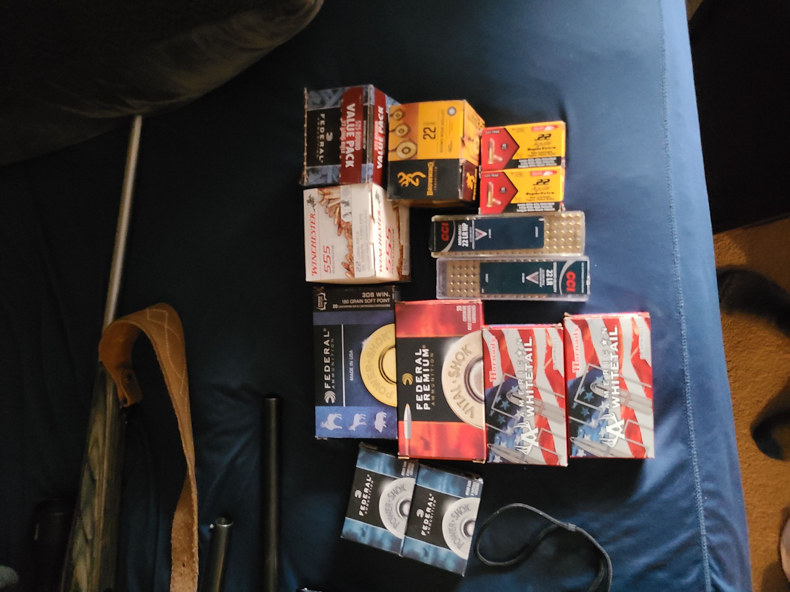 Photo of 4 guns, ammo, rangefinder, safe.