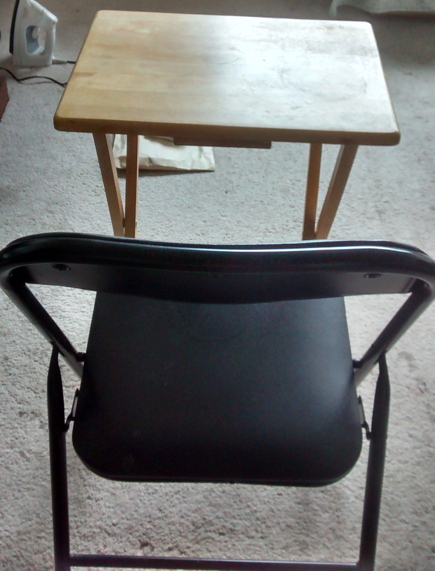 Photo of Wooden table and chair pair