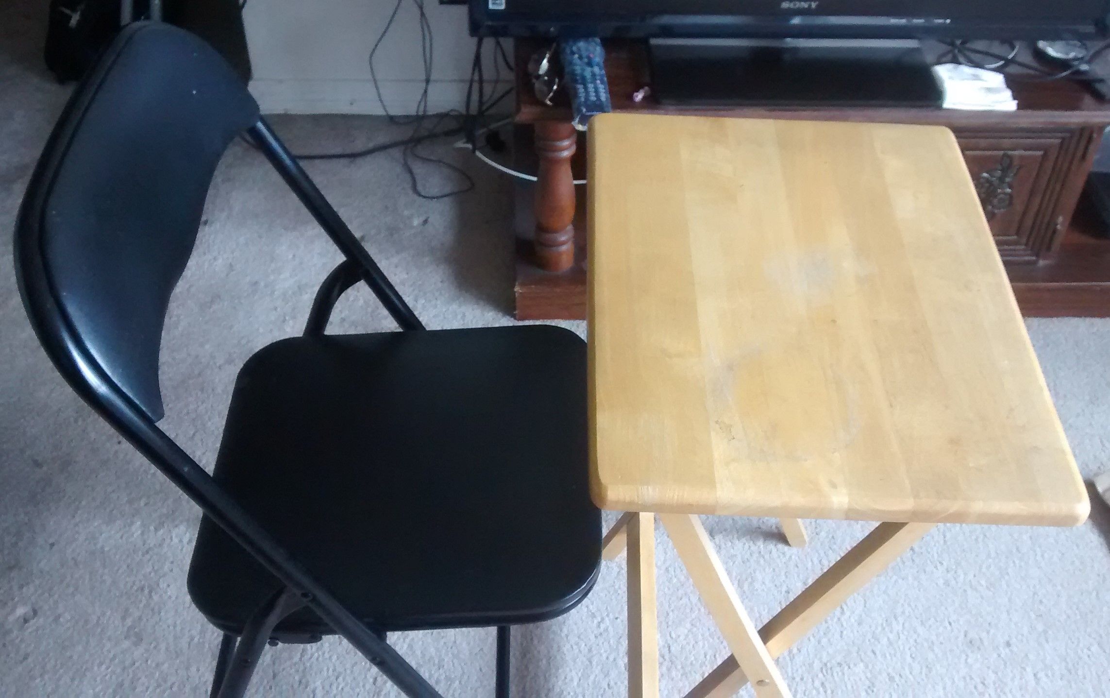 Photo of Wooden table and chair pair