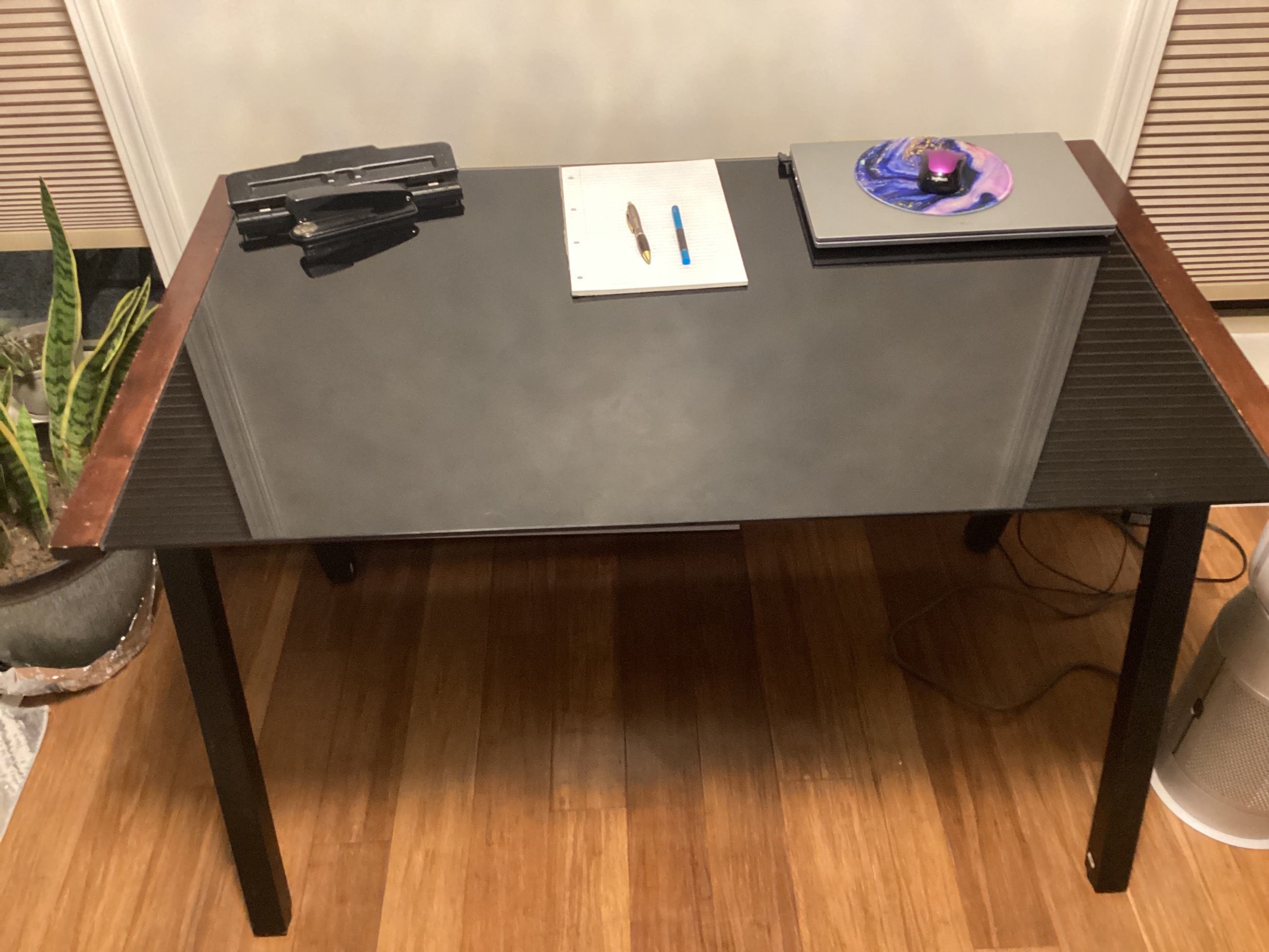 Photo of Wood and glass table top desk