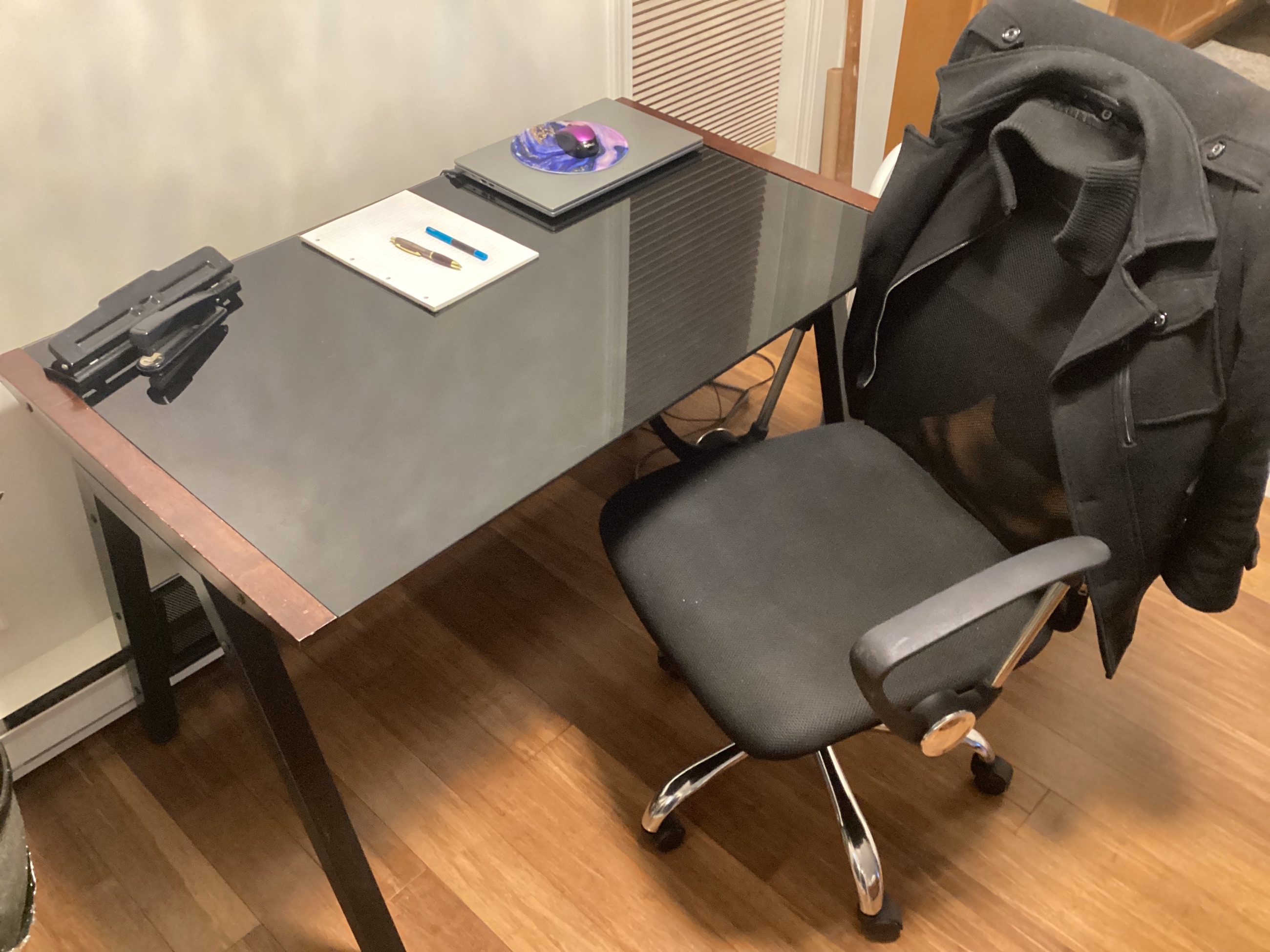 Photo of Wood and glass table top desk