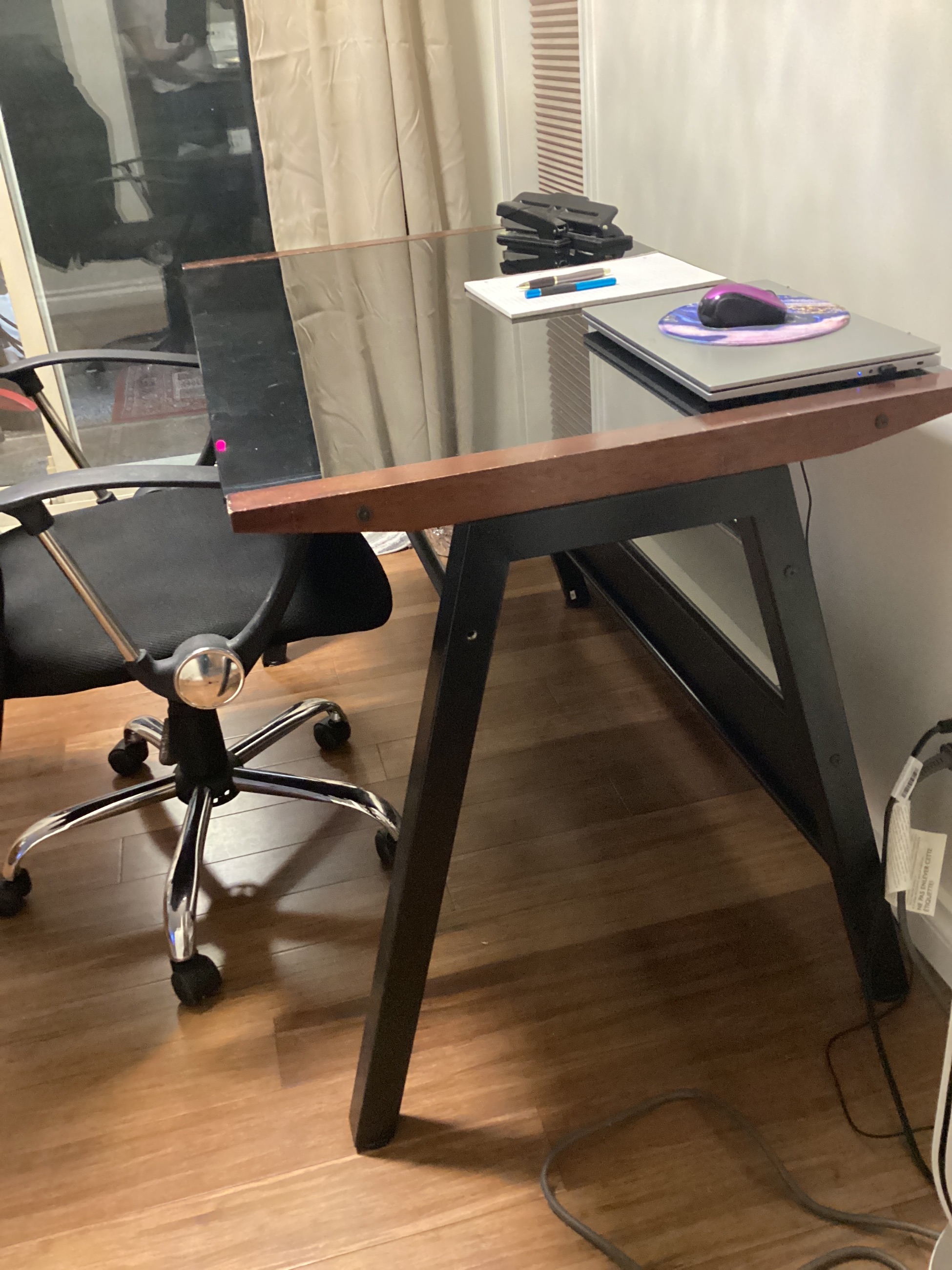 Photo of Wood and glass table top desk