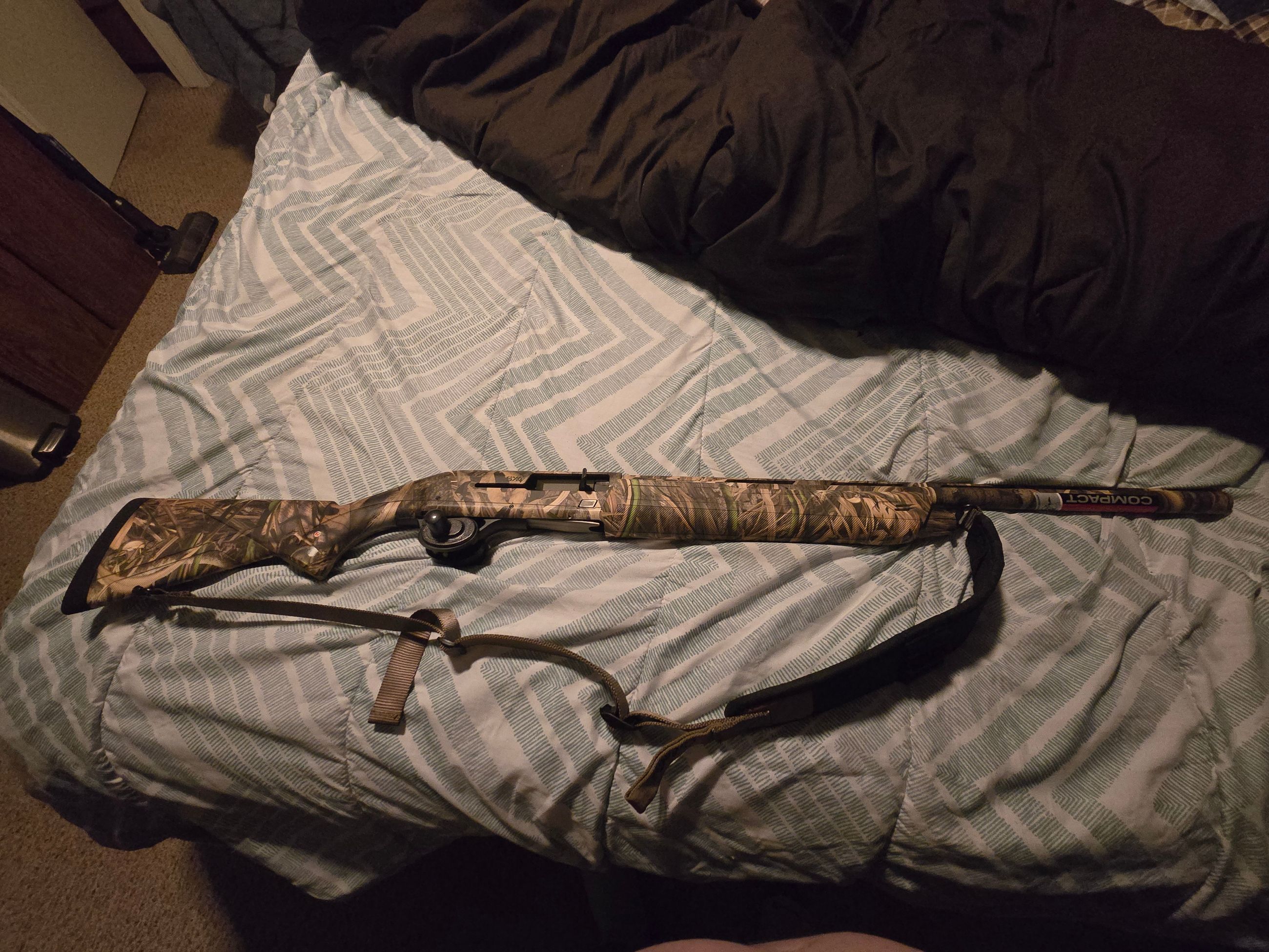 Photo of Winchester SX4 12 gage semi automatic shotgun with 9 boxes of ammunition 