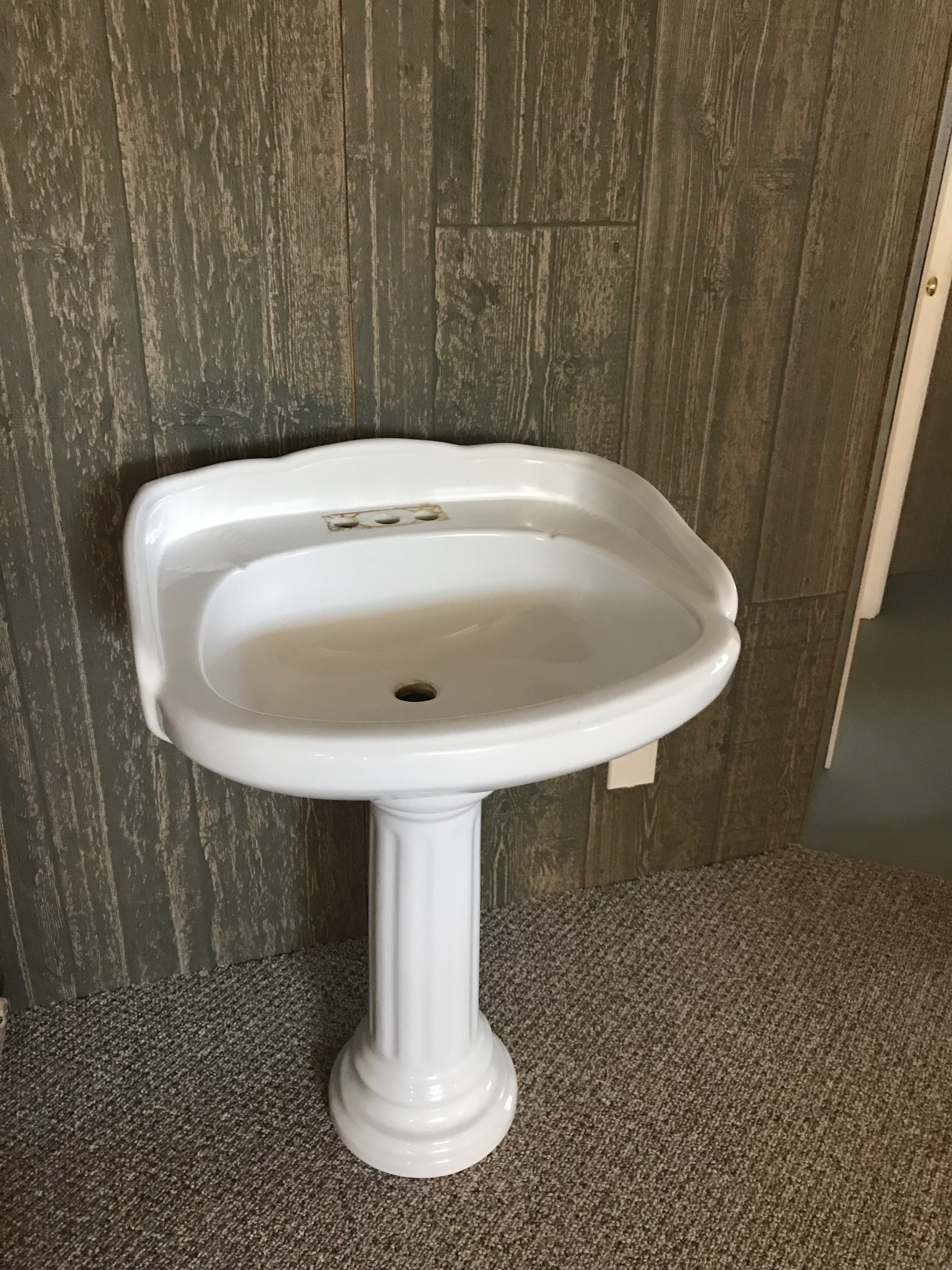 Photo of White bathroom pedestal sink