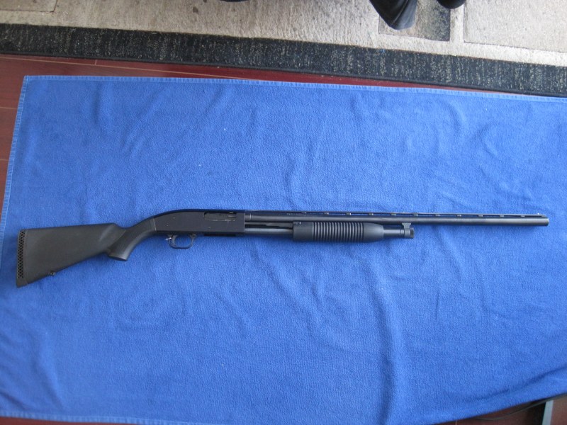 Photo of Mossberg Maverick 88 12GA pump action.