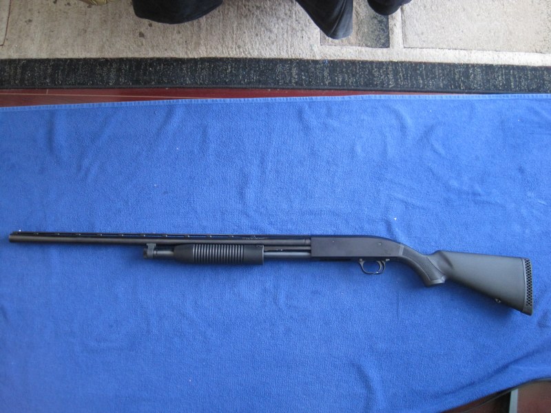 Photo of Mossberg Maverick 88 12GA pump action.