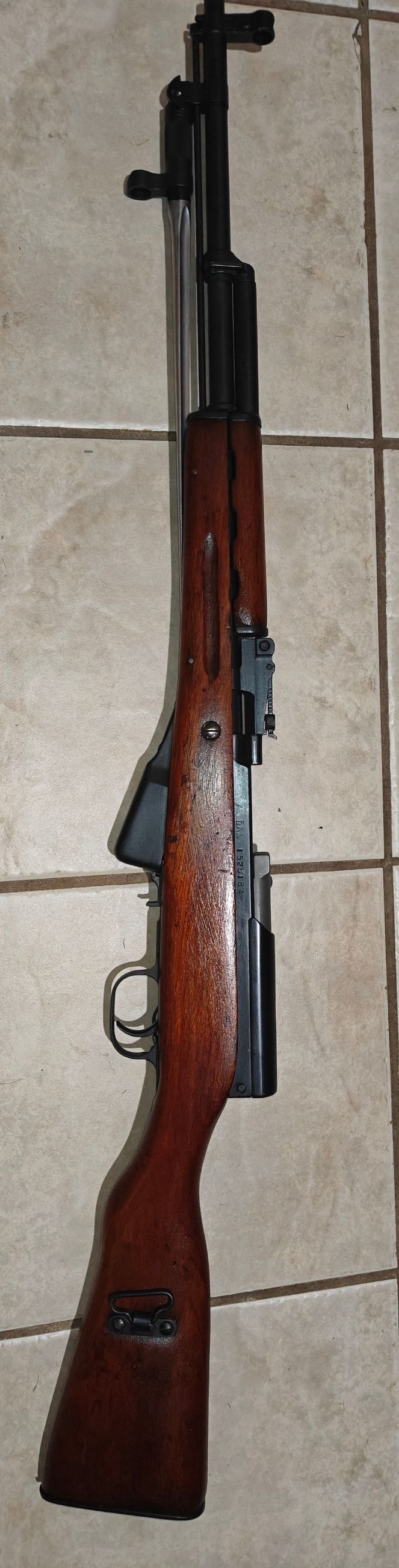 Photo of Chinese SKS with ammo, strippers and sight adjustment tool