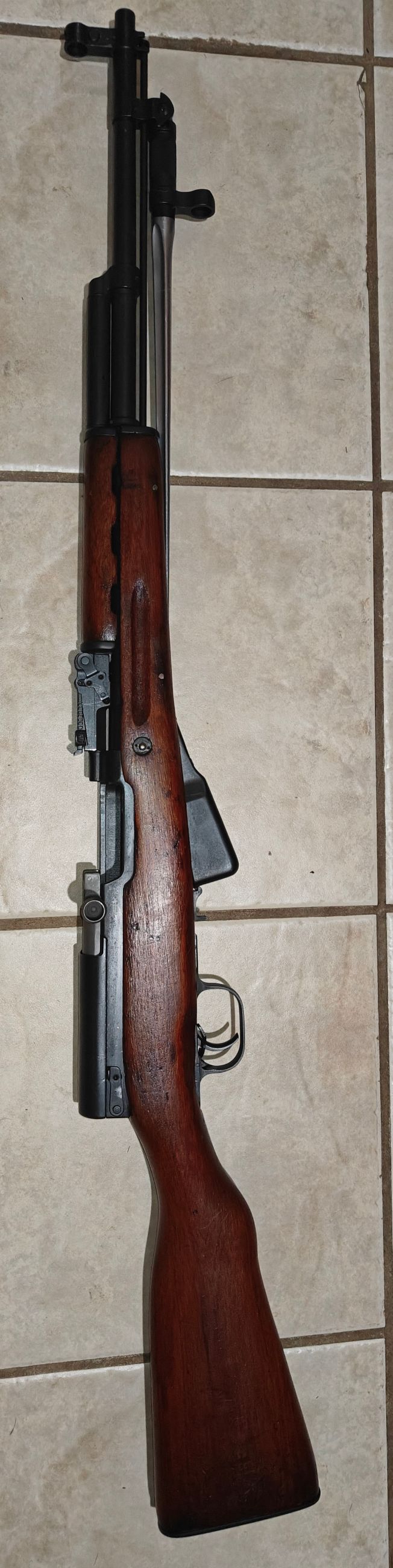 Photo of Chinese SKS with ammo, strippers and sight adjustment tool