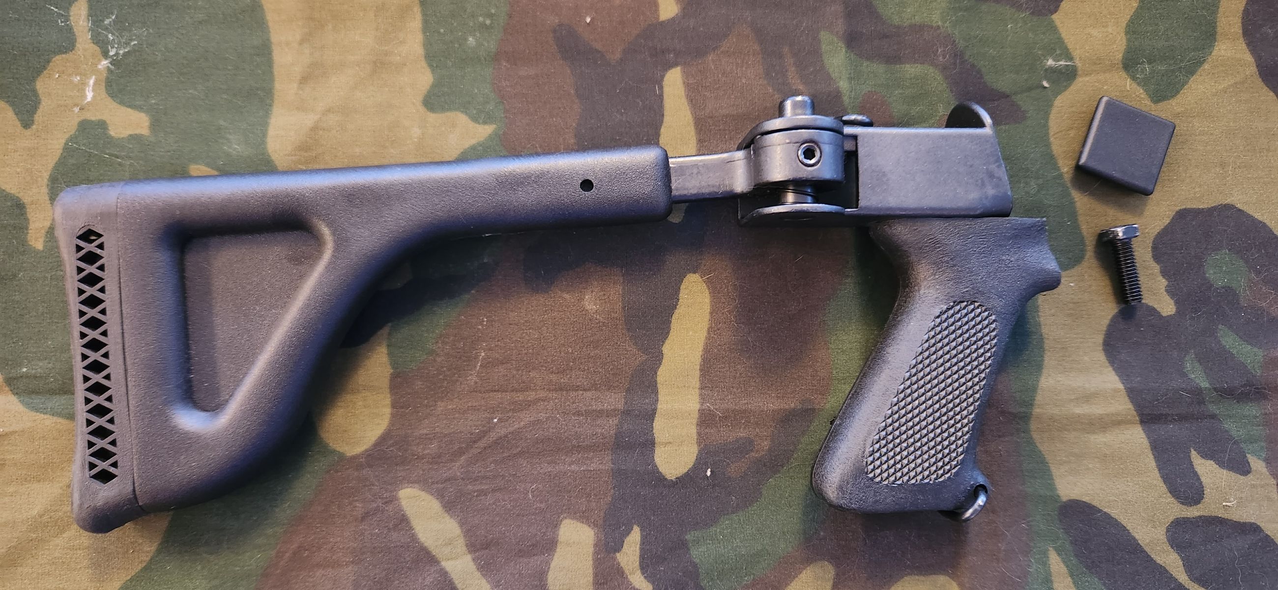 Photo of Butler Creek side fold Mossberg 88, 500, 590 shotgun stock