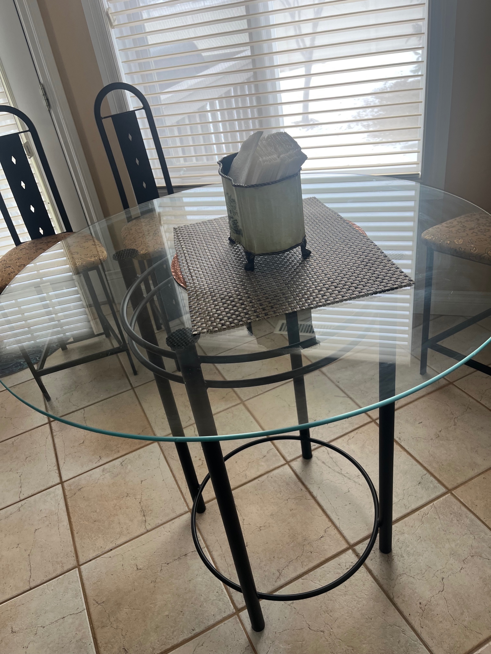 Photo of Stylish glass table and four chairs