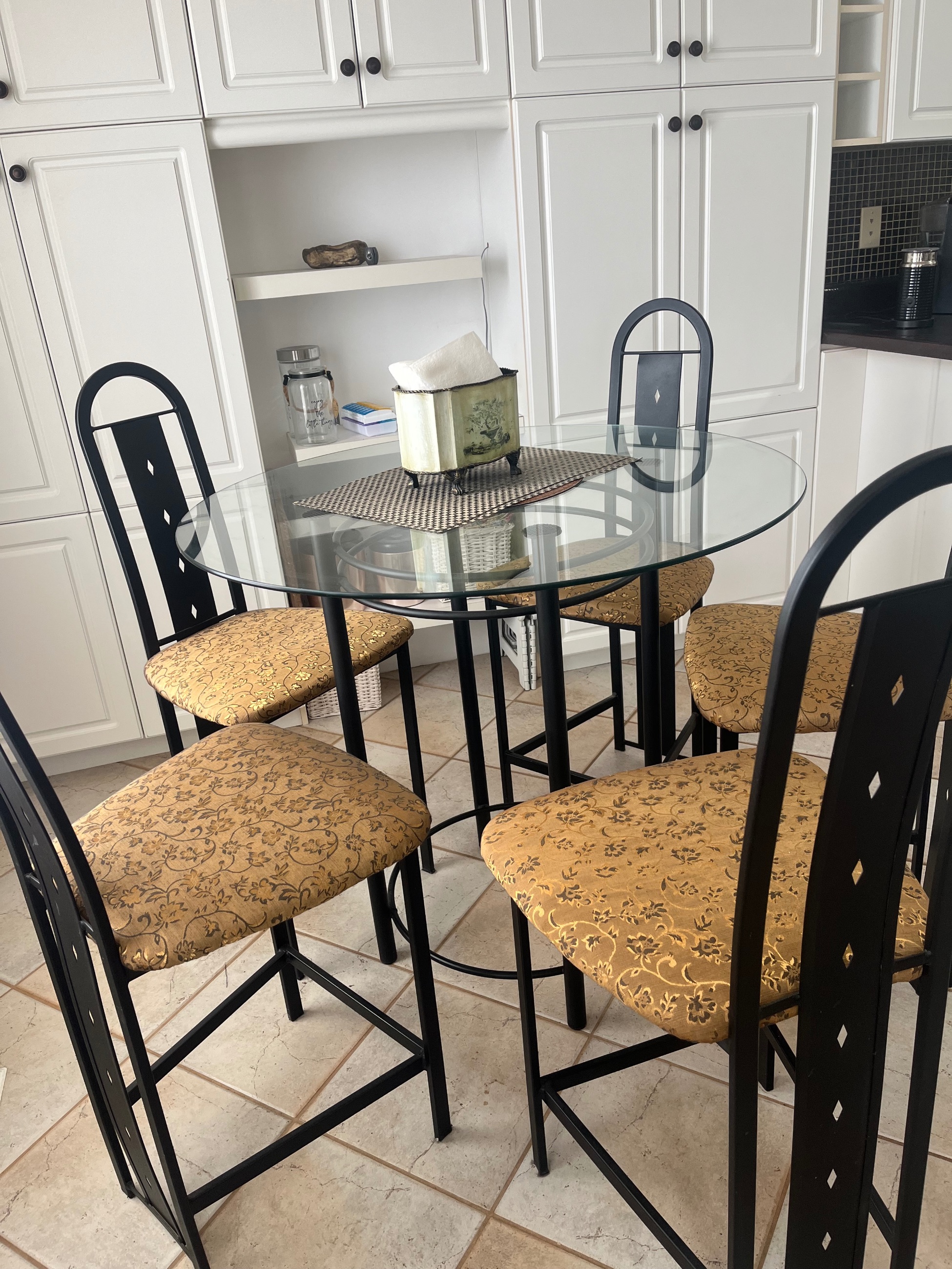 Photo of Stylish glass table and four chairs