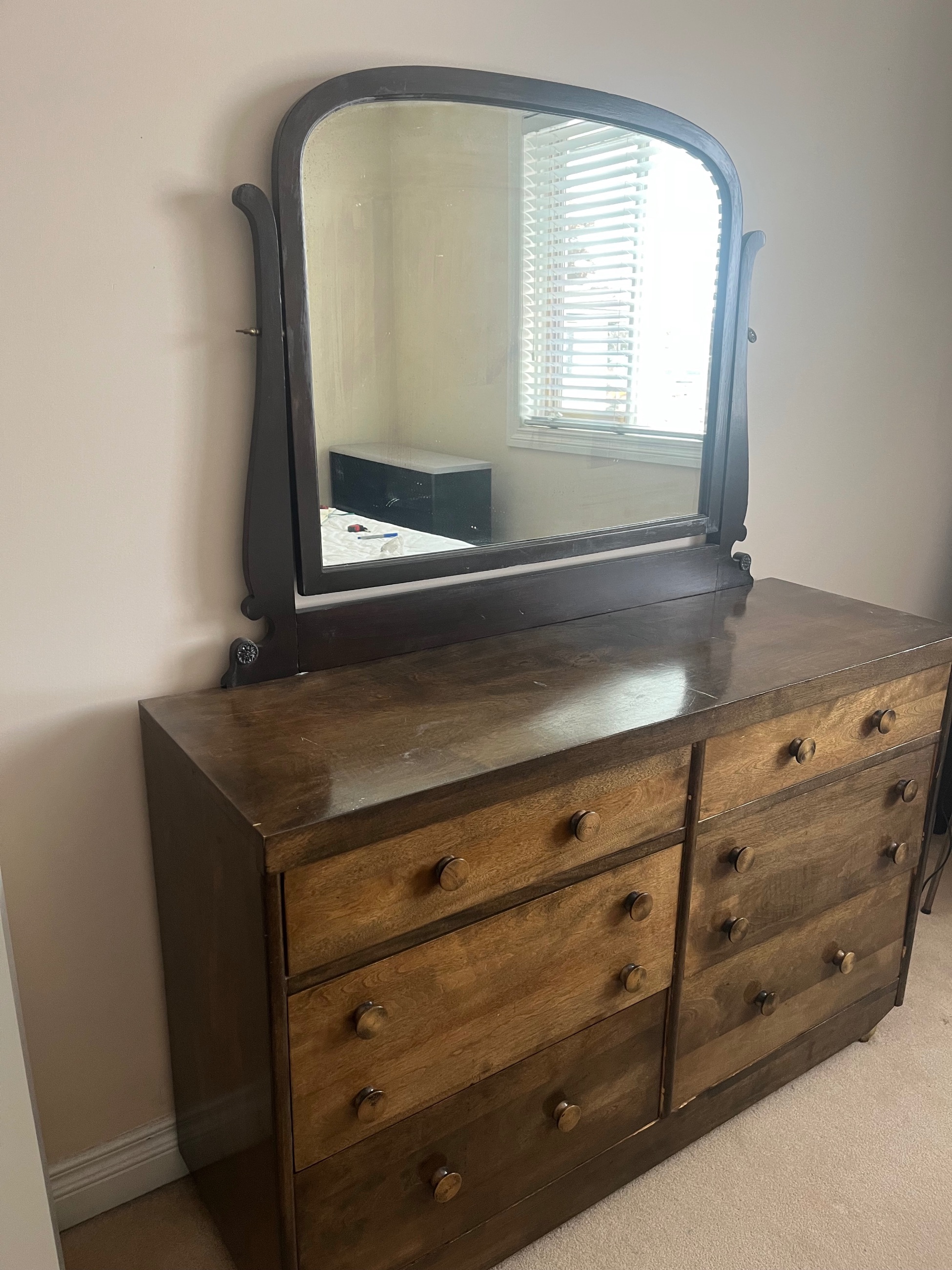 Photo of Wooden dresser with a mirror attachment